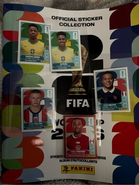 Panini Multicolor FIFA Sticker Album with Yellow, Red, Blue Accents